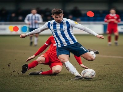 Nailsea & Tickenham striker shooting during a match